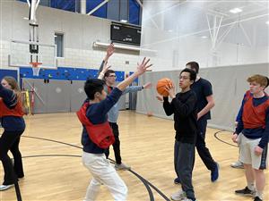 Group of teens playing basketball 