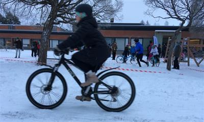 Person cycling in snow